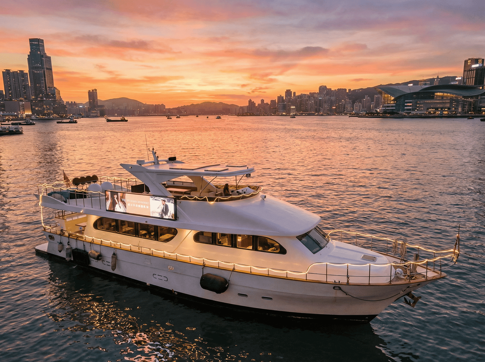 Hong Kong Victoria Harbour Night Cruise: Luxury Dreamer (Unlimited Snacks & Drinks + Professional Photography + Live Tour Ambassador) - water sports experience around the world - Tour Vigator